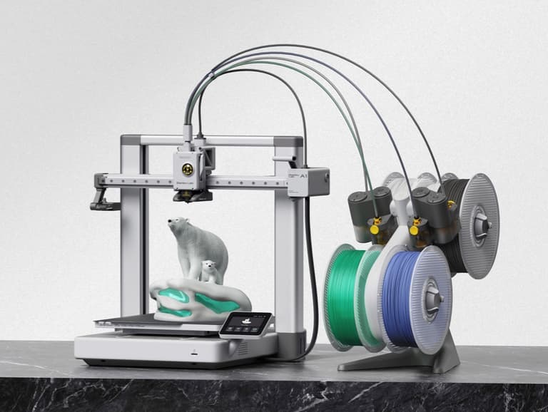 Bambu Lab A1 printer beside an AMS Lite holding four filament spools, with a multicolour polar bear model on the print bed